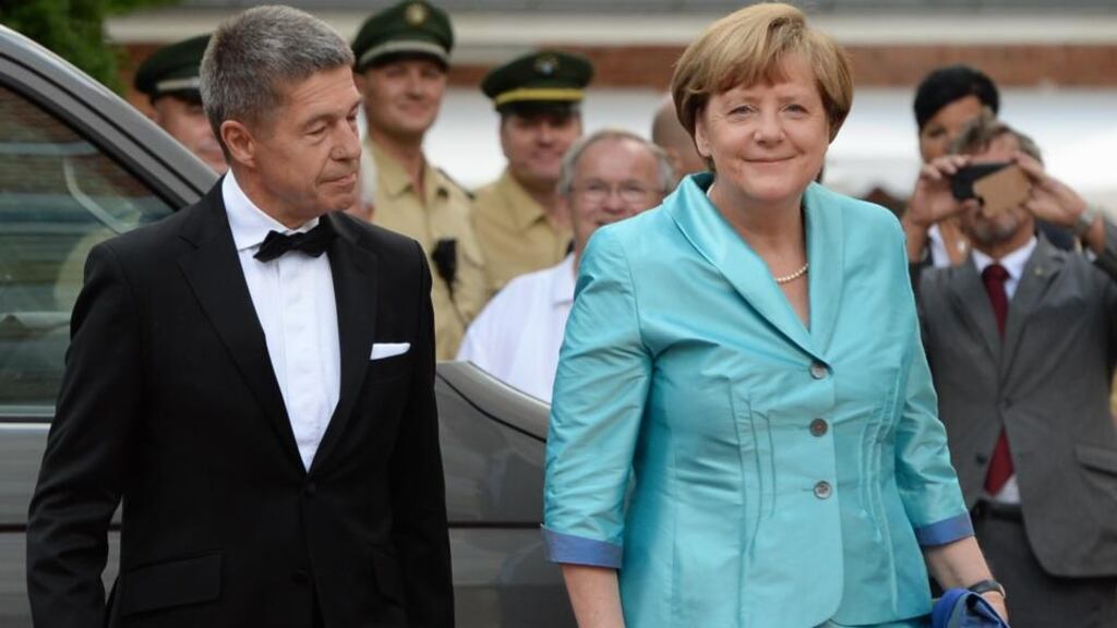 Journalists pointed out Angela Merkel had worn her outfit to Bayreuth before. As usual no one pointed out that her husband Joachim Sauer has been wearing the same tuxedoes to Bayreuth for years. Photograph: Christof Stache/AFP/Getty Images