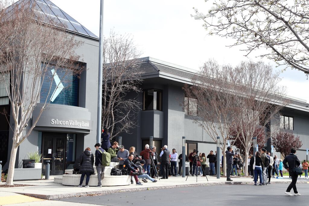 Customers wait outside the headquarters of Silicon Valley Bank in Santa Clara, California. The Federal Deposit Insurance Corporation took control of the bank's assets, making it the largest bank to do so since the 2008 financial crisis
