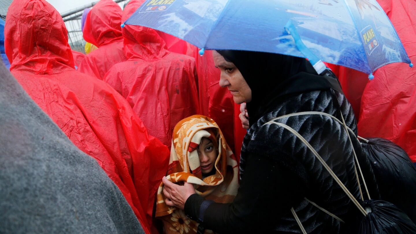 A child looks on as migrants wait in a no man’s land at the border crossing with Slovenia in Trnovec, Croatia, on Monday. Photograph: Reuters