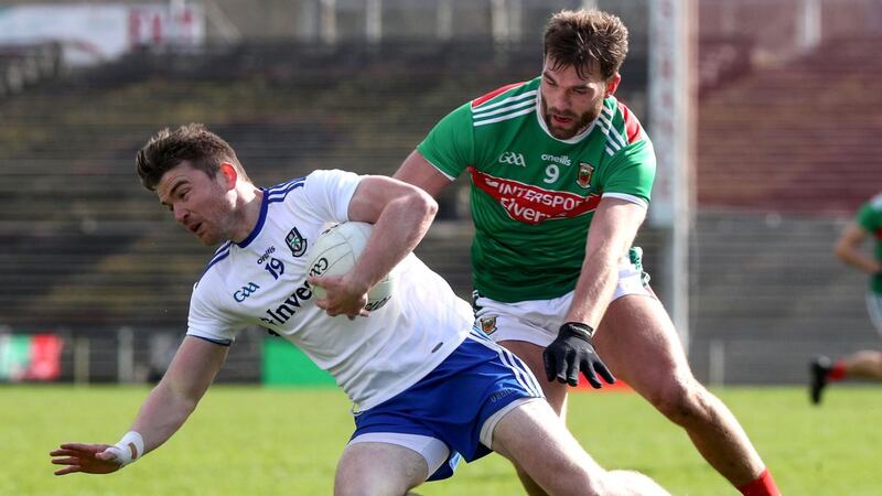 Monaghan’s Dessie Mone is challenged by Aidan O’Shea of Mayo during the Allianz Football League Division 1 match at Elverys MacHale Park in Castlebar. Photograph: Bryan Keane/Inpho