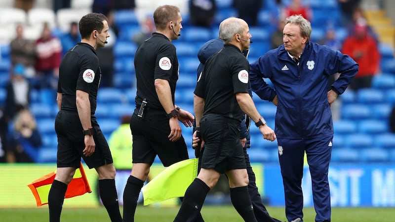 Neil Warnock confronts referee Craig Pawson after Cardiff’s late defeat to Chelsea. Photograph: Michael Steele/Getty