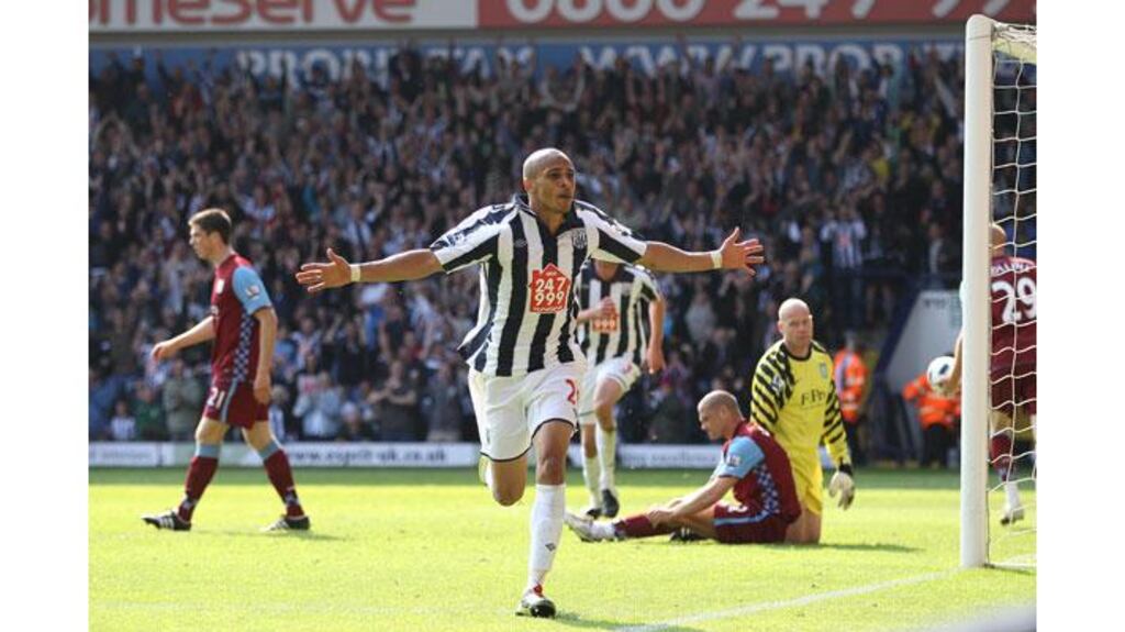 West Bromwich Albion's Peter Odemwingie (centre) celebrates after scoring during their Premier League win against Aston Villa at The Hawthorns. Photograph: Nick Potts/PA Wire