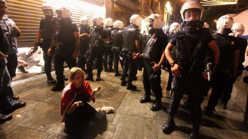 A demonstrator is surrounded by riot police during an anti-government protest in central Istanbul last night. Photograph: Reuters