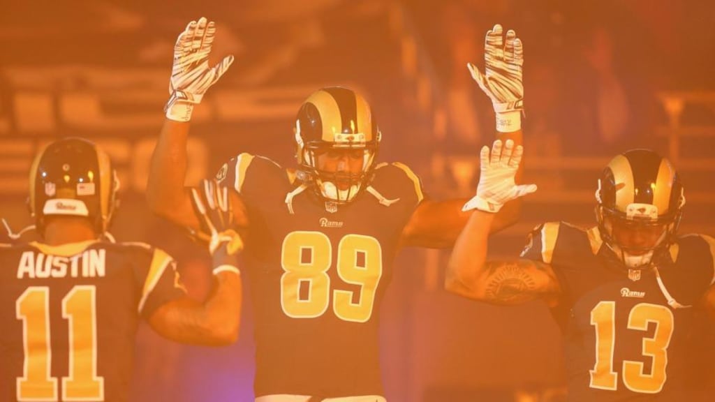 St Louis Rams players hold their hands in the air  in a gesture of solidarity with protesters over the shooting of black teenager Michael Brown. Photograph: Dilip Vishwanat/Getty Images