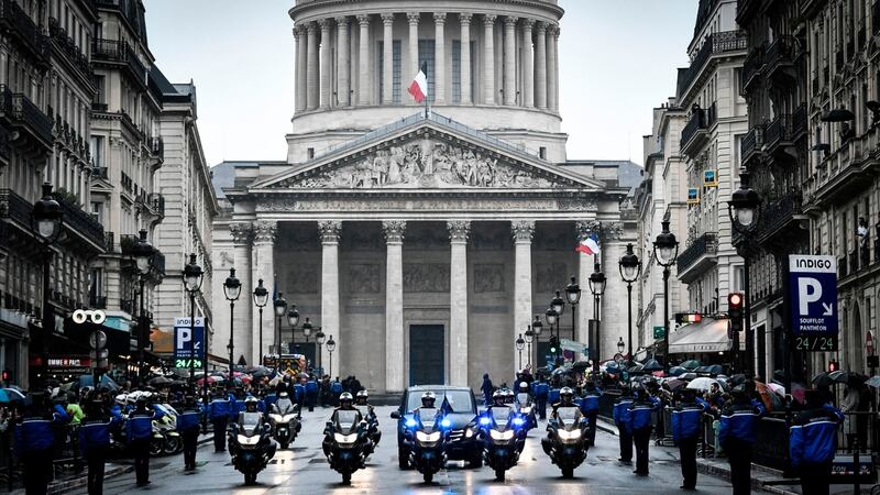 Gendarmes escort the coffin of the late Lieutenant Colonel Arnaud Beltrame in front of the Pantheon in Paris. Photograph: Stephane De Sakutin/AFP/Getty Images