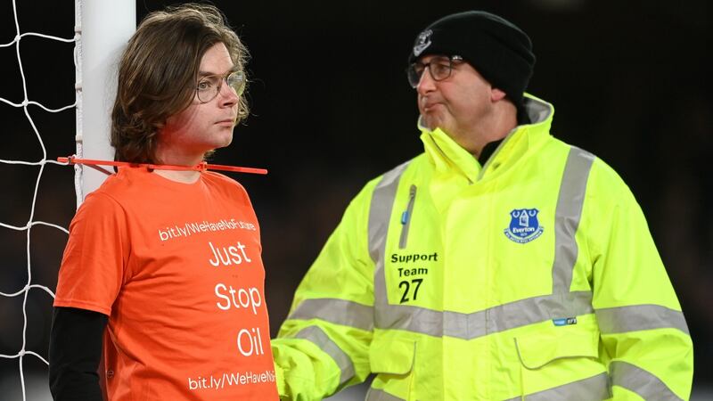 A fan ties himself to the post in protest during the Premier League match between Everton and Newcastle United at Goodison Park. Photograph: Michael Regan/Getty Images