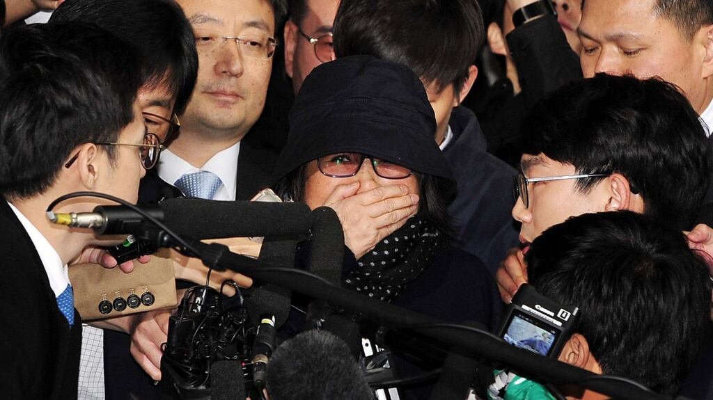 Choi Soon-sil, who is alleged of having meddled in state affairs and peddled influence on various state projects by exploiting her friendship with South Korean president Park Geun-hye, arrives for questioning in Seoul, South Korea. Photograph: Jung Ui-chel/EPA