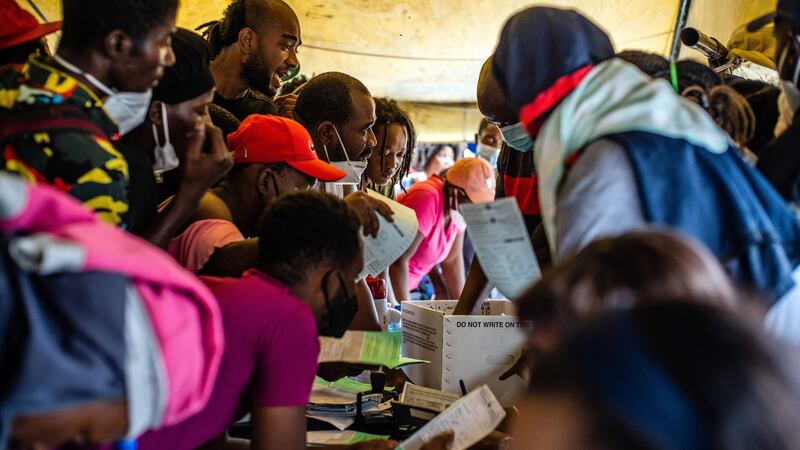 Haitian deportees are processed after arriving at the airport in Port-au-Prince on Sunday. Photograph: Federico Rios/New York Times