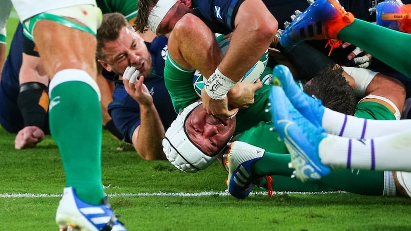 Ireland skipper Rory Best twists to score the second try against Scotland. Photograph: Craig Mercer/Inpho