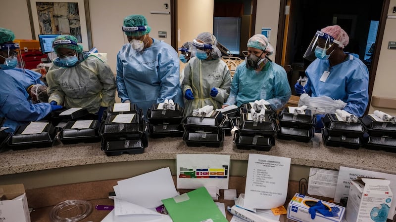Medical staff in the reception area for dinner in the serious infectious disease unit at a DHR Health hospital in Edinburg, Texas. Photograph: Lynsey Addario/New York Times