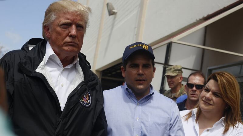 Donald Trump (L), Puerto Rico’s commissioner in Washington Jenniffer Gonzalez (R), and Puerto Rico’s governor Ricardo Rossello (C) arrive to Guaynabo in Puerto Rico on Wednesday. Photograph: Thais Llorca/ EPA