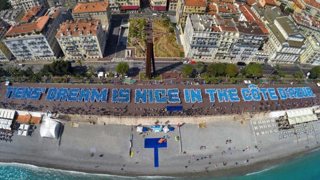 Employees of Chinese Tiens company arranging themselves on the Promenade des Anglais in the French southern resort town to spell out the phrase “Tiens’ dream is Nice in the Cote d’Azur”. Guinness World Records inspectors were on hand to watch the feat and duly declared that the visitors from China had created the longest human-made phrase visible from the sky. Photograph: HO/AFP/Getty Images