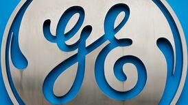 GE beats profit forecast but cuts revenue target