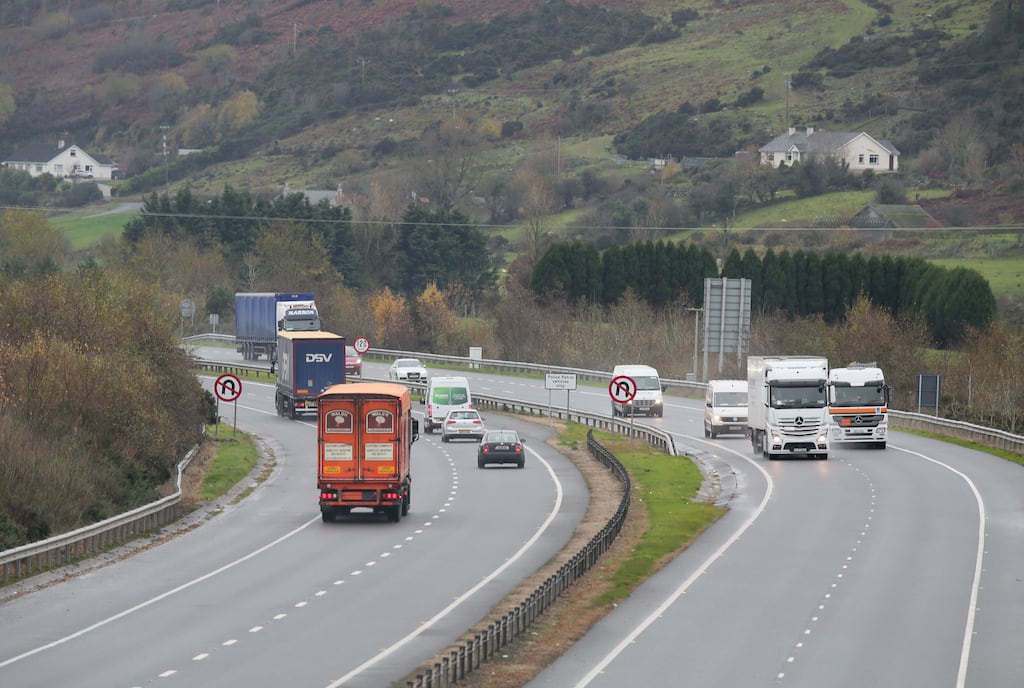 Traffic crosses the border between Northern Ireland and the Republic. Businesses in Northern Ireland involved in all-island cross-border trade have set up operations in the Republic to benefit from its lower corporation tax rate, a leading Belfast-based tax expert has said. Photograph: Paul Faith/AFP.
