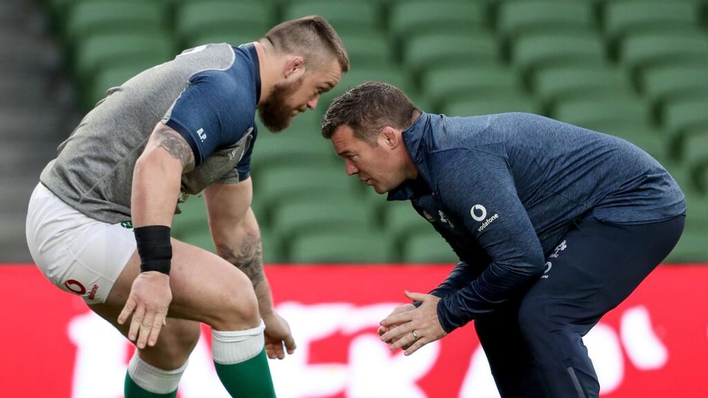 Ireland scrum coach John Fogarty works with prop Andrew Porter during the captain’s run at the Aviva stadium. Photograph: Dan Sheridan/Inpho
