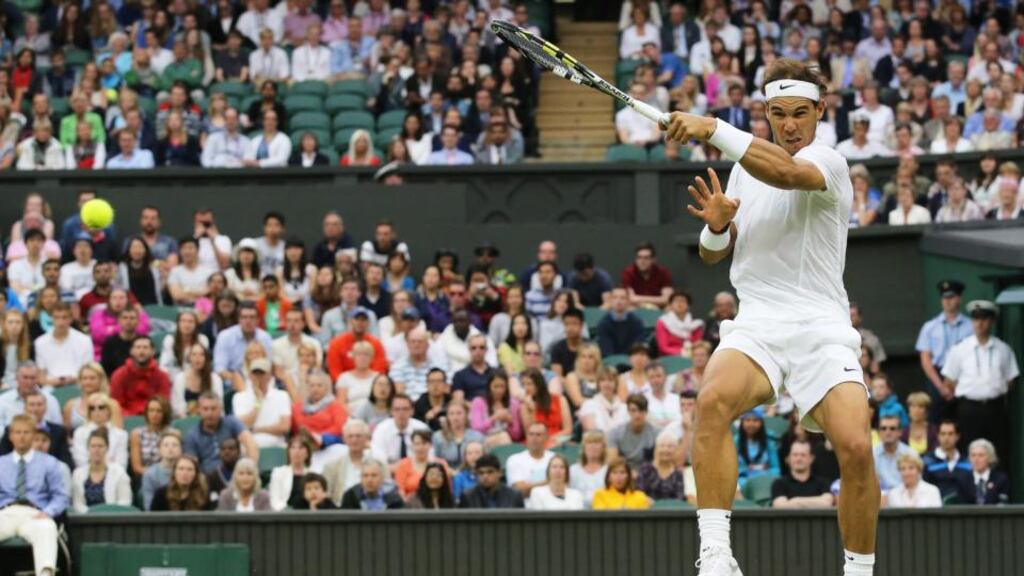 Rafael Nadal returns to Mikhail Kukushkin during their third-round match at Wimbledon. Photograph: Tatyana Zenkovich/EPA