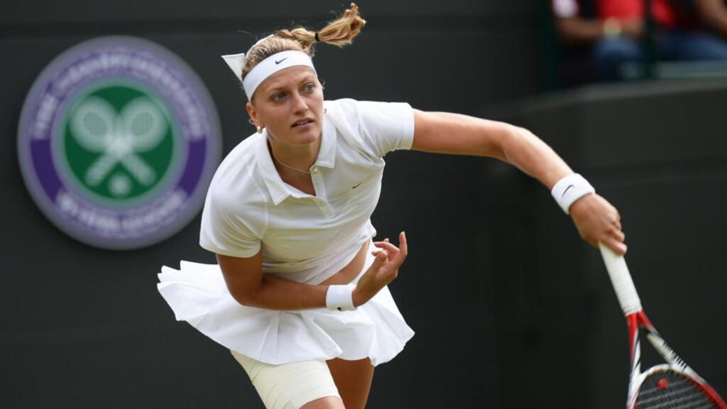 Petra Kvitova serves to Mona Barthel of Germany in their second round match at Wimbledon yesterday. Photograph: EPA