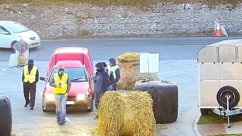 A photograph supplied by ABP, showing what the company said were protesters wearing balaclavas allegedly outside its Cahir facility. Photograph: ABP