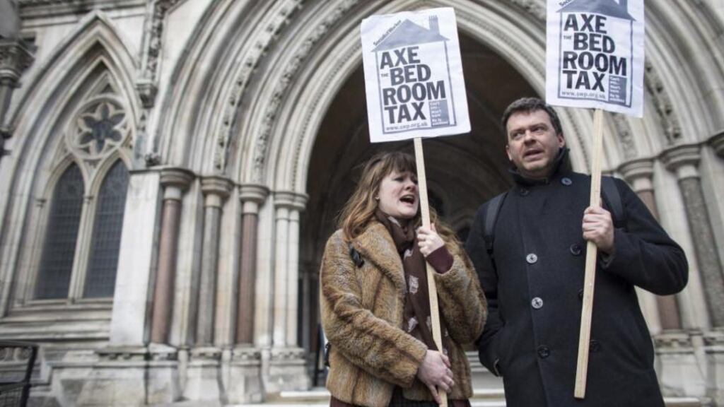 Campaigners demonstrate yesterday outside the Royal Courts of Justice in London against the British government’s reform to limit housing benefit, known as the bedroom tax. Photograph: Oli Scarff/Getty Images