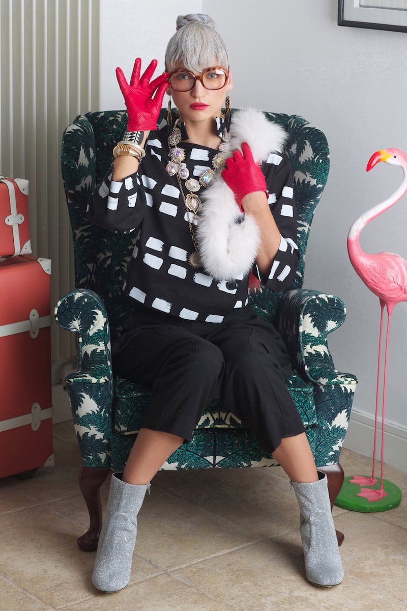 Jacket €620, trousers €265, Vivienne Westwood, Brown Thomas. Dakota earrings €169, black and white Sianode bracelet €179, Fiona Paxton, crystal bangle €205, silver lucite bangle €309, Alexus Bittar, long Tulsa necklace €249, Lulu Frost, Loulerie. Necklace €289, Butler & Wilson, Design Centre. Yves Saloman fur €280, Costume. Gloves “Sasha” €90, Paula Rowan. Boots €75, River Island. Cases from Correspondent collection steamlineluggage.com ranging from €315- €785