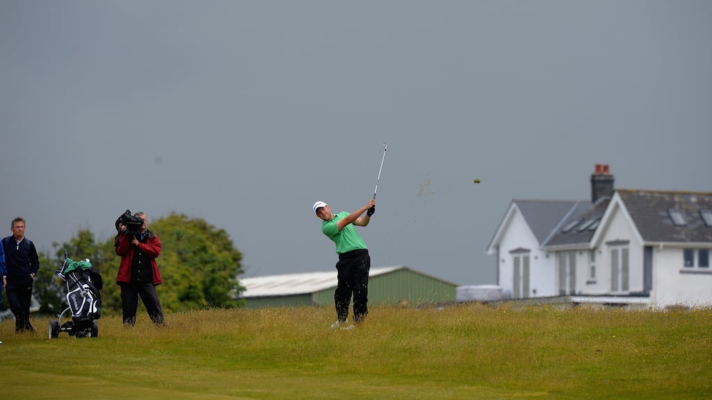 Paul McBride of The Island plays an approach shot during the Amateur Championship at Royal Porthcawl. Photo: Getty Images