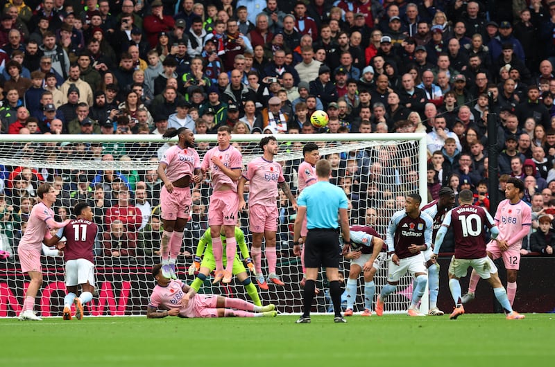 Aston Villa's Emi Buendia scores his side's first goal of the game. Photograph: Nigel French/PA