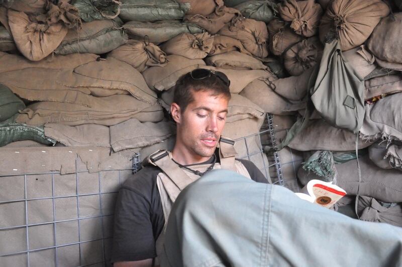 Someone sent Colum McCann a photo of James Foley in a bunker (above) absorbed in Let The Great World Spin, McCann’s novel. 'It was devastating and powerful and all those things,' McCann explains.