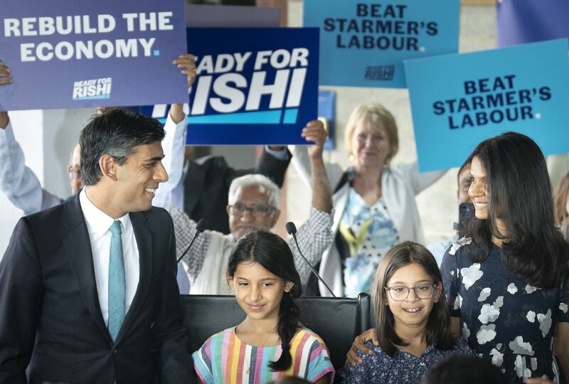 Rishi Sunak, with daughters Krishna, Anushka and wife Akshata Murty, during a visit to Vaculug tyre specialists at Gonerby Hill Foot, Grantham, as part of his campaign to be leader of the Conservative and Unionist Party and the next prime minister. Picture date: Saturday July 23, 2022.