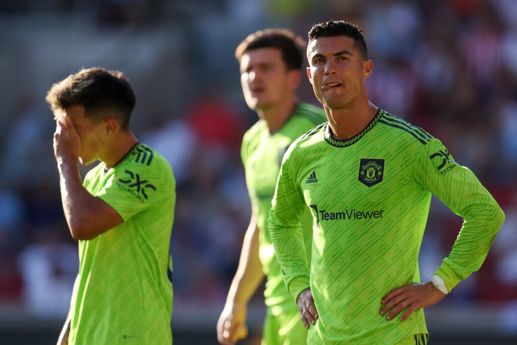 Cristiano Ronaldo and Lisandro Martinez during Manchester United's defeat at Brentford on Saturday. Photograph: Catherine Ivill/Getty Images