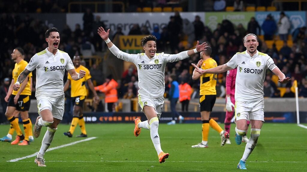 Luke Ayling celebrates scoring their third goal with Robin Koch and Rodrigo Moreno during the Premier League match against Wolves at at Molineux Photograph: Laurence Griffiths/Getty Images