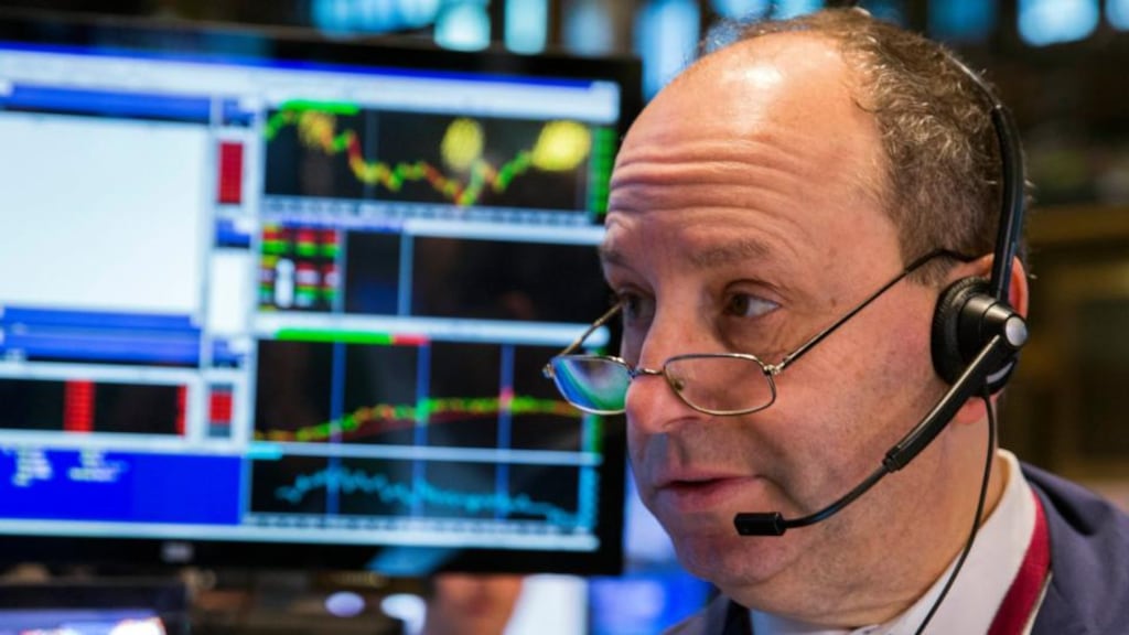 A trader works on the floor of the New York Stock Exchange shortly after the opening bell in New York. Photograp: Lucas Jackson/Reuters