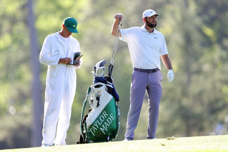 Scottie Scheffler reaches for a club from his bag during his impressive triumph at the Masters in Augusta. Photograph: Jamie Squire/Getty Images