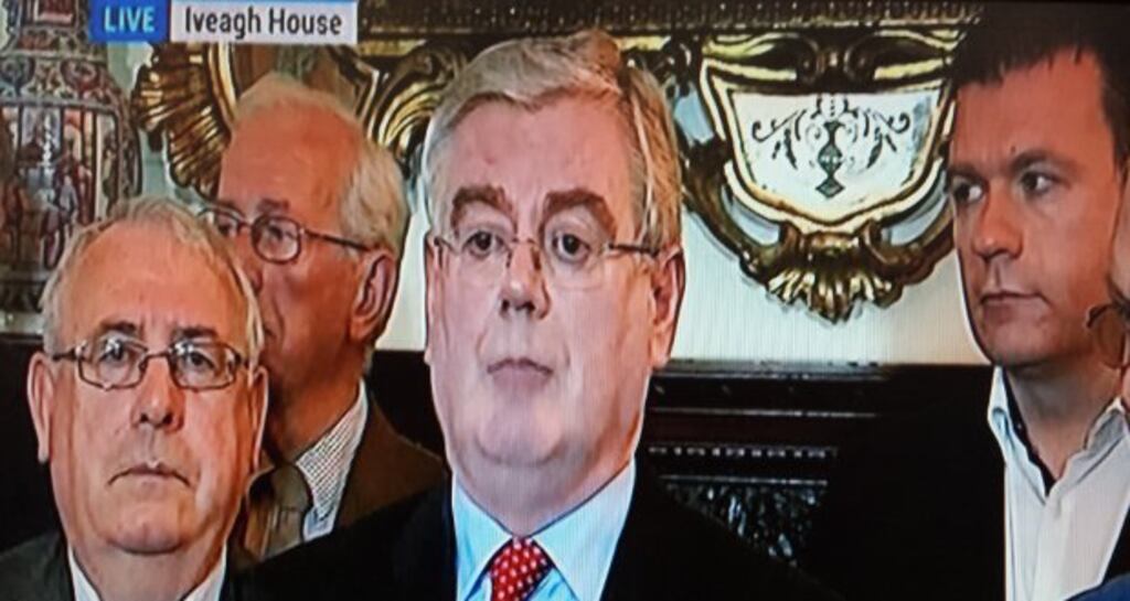 Eamon Gilmore and Labour ministeres as the Labour leader announces his resignation at a press conference in Iveagh House, Dublin. Photograph: RTÉ screengrab
