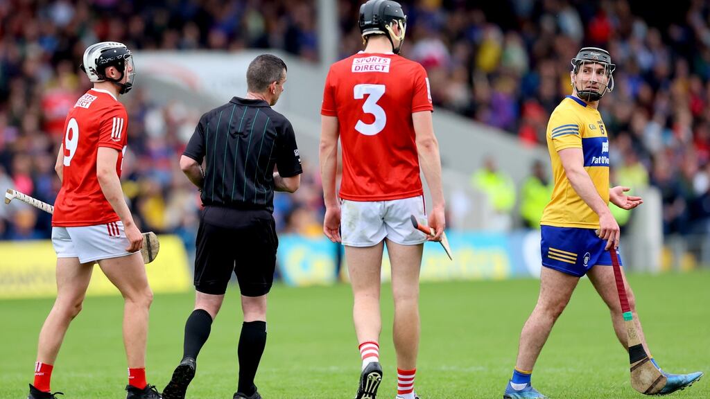 Clare’s Ian Galvin is shown a red card  by referee Paud O’Dwyer during his team’s win over Cork. Photograph: James Crombie/Inpho