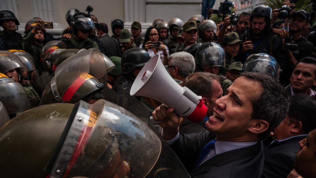 Juan Guaidó, leader of the Venezuela’s opposition, leads legislators through a National Guard blockade and into the National Assembly in Caracas on Tuesday. Photograph: Adriana Loureiro Fernández/New York Times