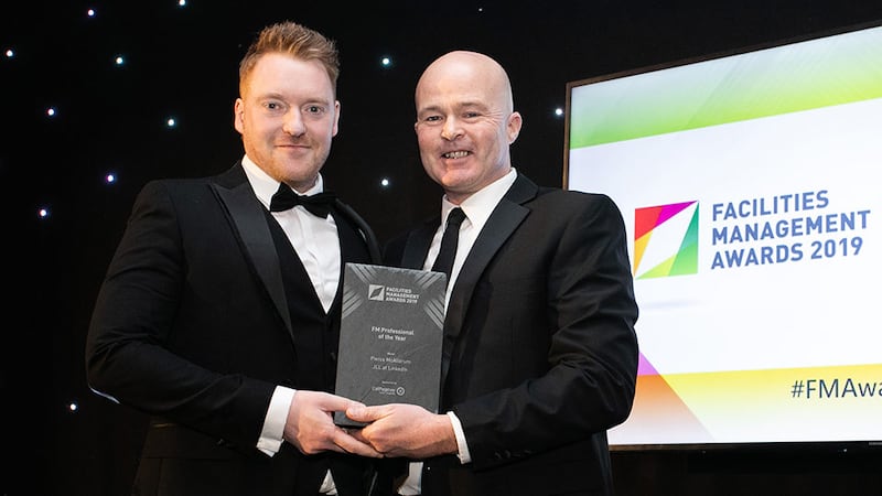 Ken Colley, Managing Director, CallPageboy Call Centre presents the FM Professional of the Year award to Pierce McAllorum, JLL at LinkedIn.