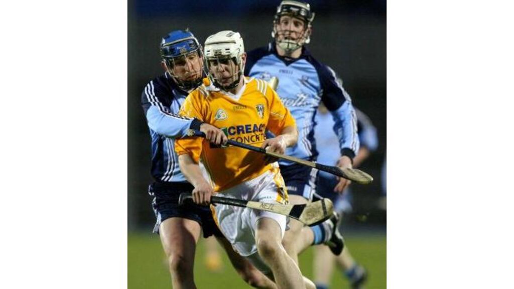 Neil McManus of Antrim does his best to hold possession and
surge away from the attentions of Dublin's Gregg Bennett and Ronan
Fallon during last night's National Hurling League, Division 1B,
encounter at Casement Park, Belfast.
