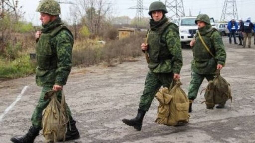 Members of the Luhansk People’s Republic leaving a disengagement area near the town of Zolote in the Luhansk region. Separatist groups have been blamed for forest fires in eastern Ukraine. Photograph: Alexander Reka\TASS via Getty Images