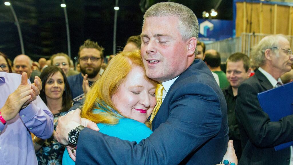 Naomi Long of the Alliance Party is congratulated by her husband Michael Long after being elected as MLA for Belfast East. Photograph: Liam McBurney/PA