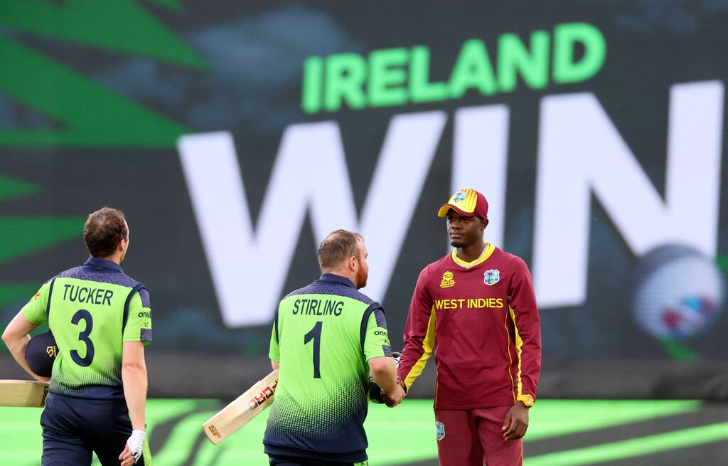 Ireland's Paul Stirling (C) shakes hands with West Indies' Alzarri Joseph after the ICC mens Twenty20 World Cup 2022 cricket match between West Indies and Ireland at Bellerive Oval in Hobart on October 21, 2022. - -- IMAGE RESTRICTED TO EDITORIAL USE - STRICTLY NO COMMERCIAL USE -- (Photo by DAVID GRAY / AFP) / -- IMAGE RESTRICTED TO EDITORIAL USE - STRICTLY NO COMMERCIAL USE -- (Photo by DAVID GRAY/AFP via Getty Images)