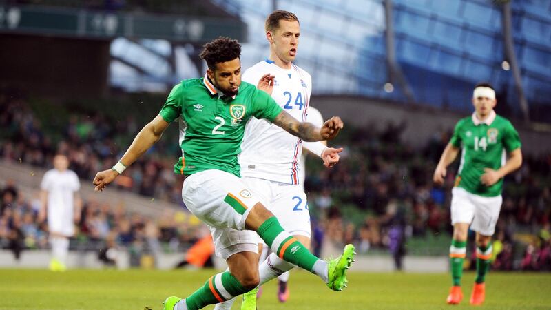 Cyrus Christie clears away from Kjartan Henry Finnbogason. Photo: Aidan Crawley/EPA