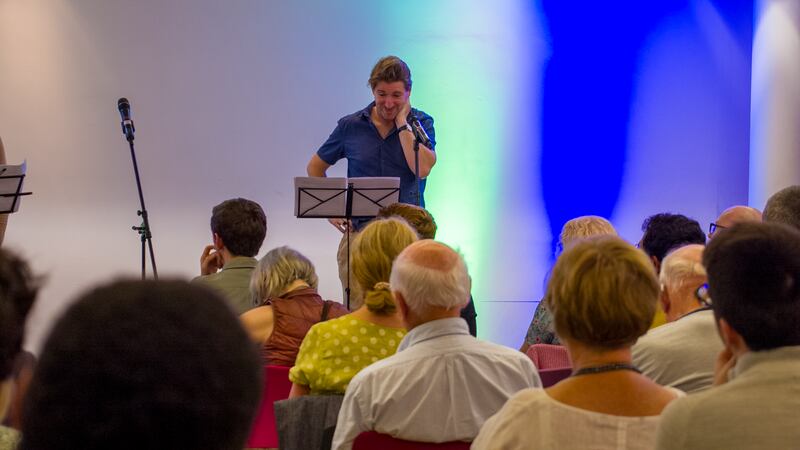 John Cronin performing Gill Buckle's play A Survivor's Guide to the End of the World (As We Know It) at Pierce Street Library.