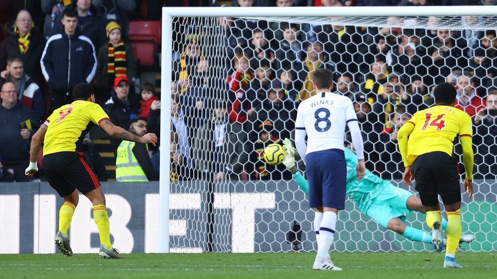 Tottenham’s Paulo Gazzaniga saves Troy Deeney’s penalty. Photograph: Richard Heathcote/Getty
