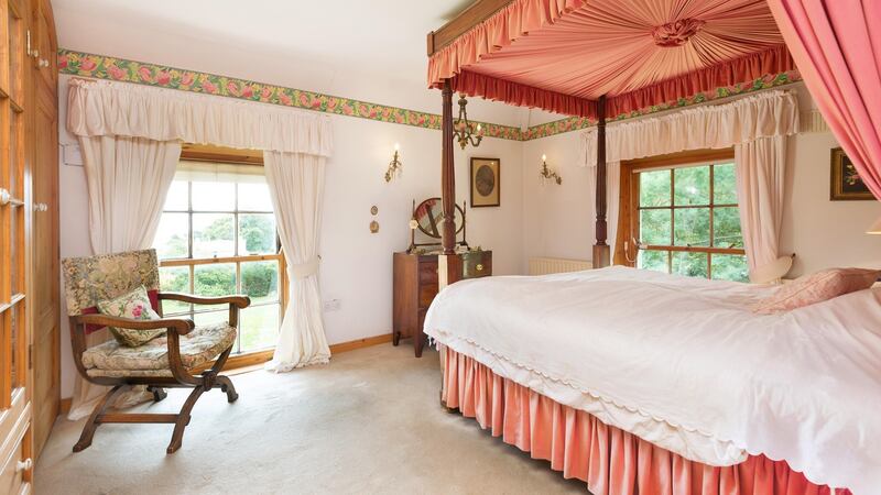 Master bedroom with four-poster bed at Field Lodge, Killiney Heath, Killiney, Co Dublin