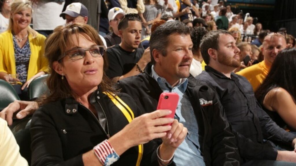 Former Alaska governor Sarah Palin and husband Todd Palin at a basketball game in Indianapolis, Indiana in 2013. Photograph: Ron Hoskins/NBAE via Getty Images