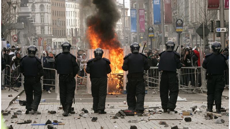 Riot police on O’Connell Street after violence over a planned loyalist parade through the city in February 2006. File photograph: Dara Mac Dónaill