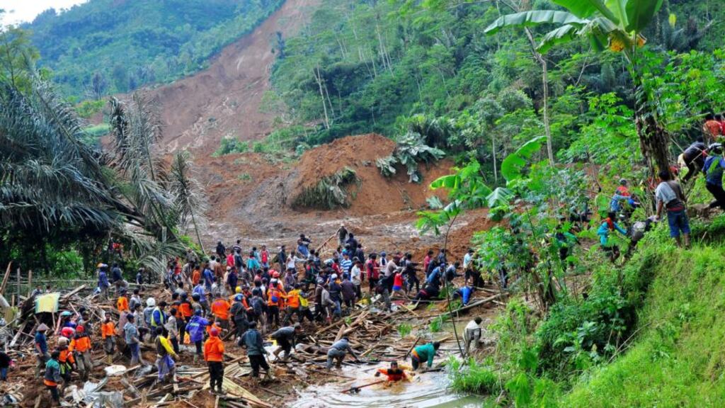 Indonesian rescuers search for victims after a landslide hit Jemblung village. Photograph: Himawan Listya Nugraha/EPA