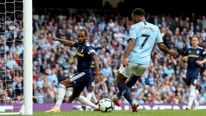 Raheem Sterling scores Manchester City’s third against Fulham. Photograph: Martin Rickett/PA