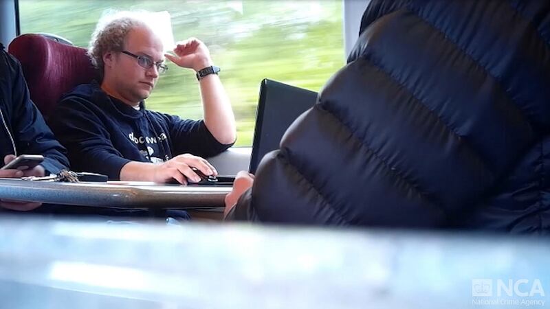 A still taken from surveillance footage of Matthew Falder on a train. Photograph: National Crime Agency/PA Wire