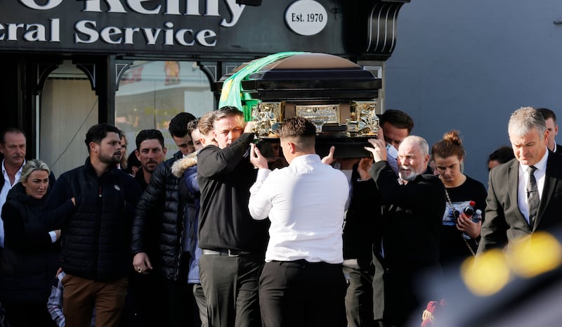 The casket of Tom Dooley is carried into the Church of the Assumption, in Tullamore on Thursday. Photograph: Alan Betson